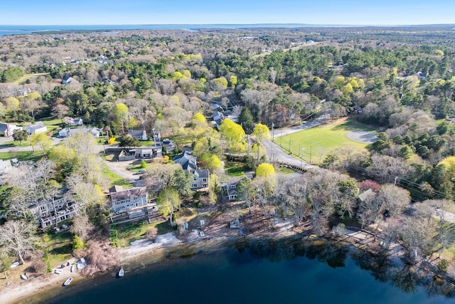 aerial view with a water view and a view of trees