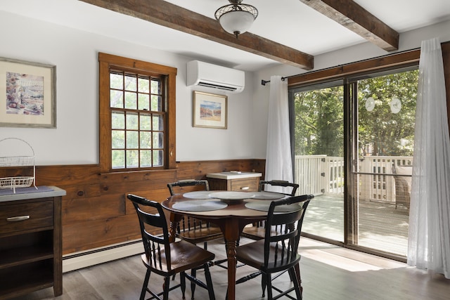 10 Devonshire Ln, South Dennis, MA 02660 - dining room featuring a wall mounted AC, baseboard heating, beamed ceiling, wainscoting, and wood finished floors