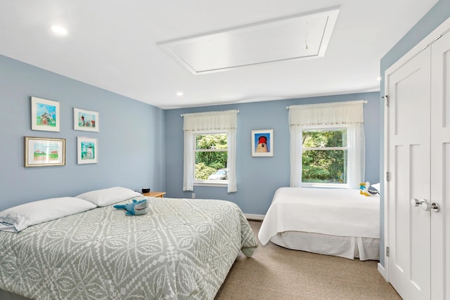 bedroom with attic access, baseboards, carpet, a closet, and recessed lighting