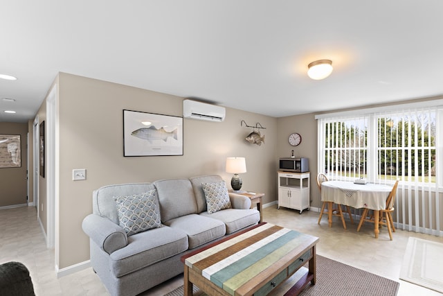 living room featuring a wall mounted air conditioner and baseboards