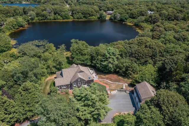 aerial view with a forest view and a water view