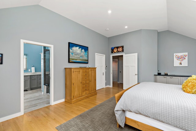 bedroom with recessed lighting, light wood-style flooring, connected bathroom, high vaulted ceiling, and baseboards