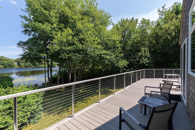 wooden deck featuring a water view