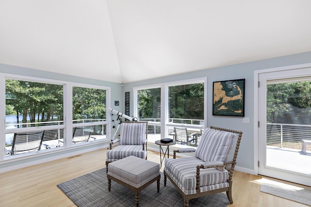 sunroom / solarium featuring vaulted ceiling and visible vents