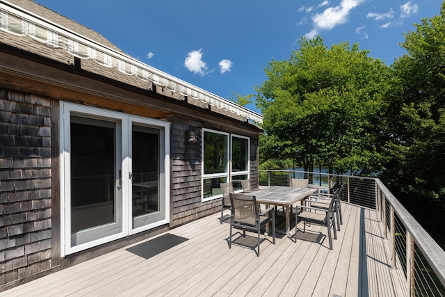 wooden terrace with outdoor dining area