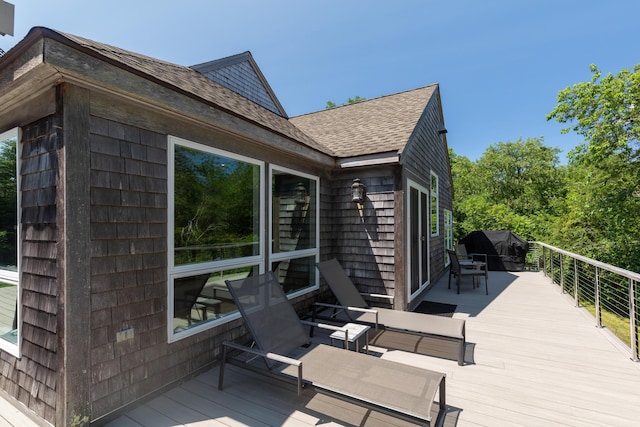 wooden terrace featuring grilling area