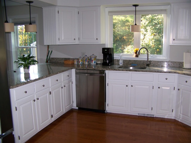 kitchen featuring stainless steel dishwasher, dark wood-style floors, white cabinetry, and a sink