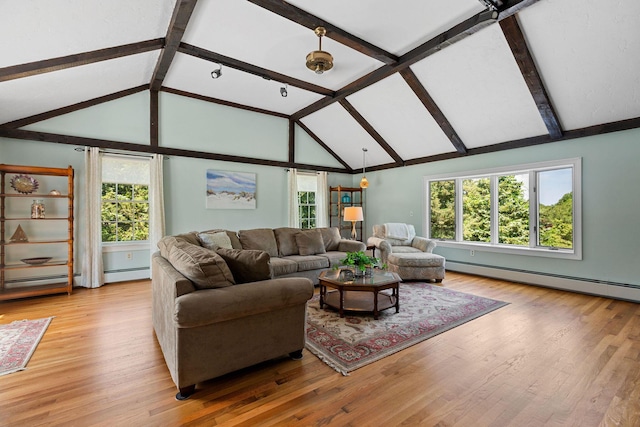 10 Briarfield Rd, South Dennis, MA 02660 - living room featuring a baseboard radiator, beam ceiling, plenty of natural light, high vaulted ceiling, and light wood-style flooring