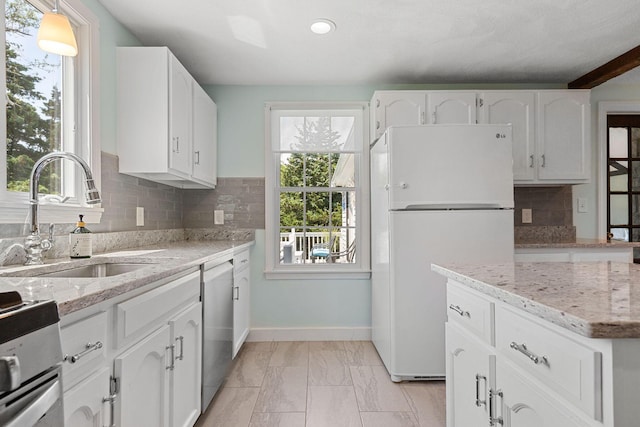 10 Briarfield Rd, South Dennis, MA 02660 - kitchen featuring freestanding refrigerator, dishwasher, stove, healthy amount of natural light, and recessed lighting