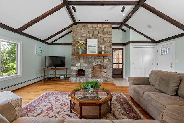 10 Briarfield Rd, South Dennis, MA 02660 - living room with wood finished floors and a stone fireplace
