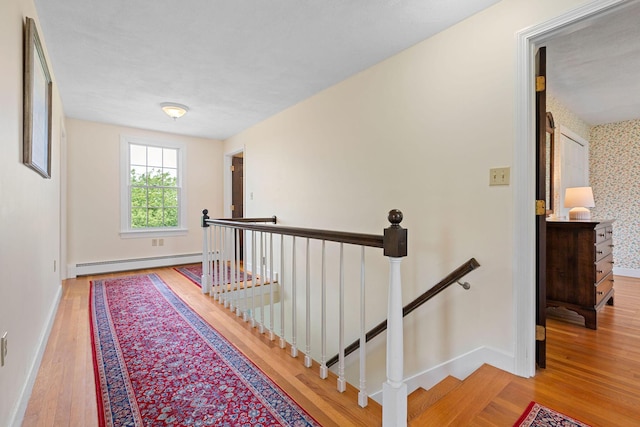 10 Briarfield Rd, South Dennis, MA 02660 - hall with an upstairs landing, a baseboard radiator, and wood finished floors
