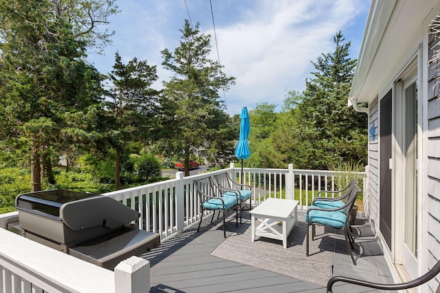 10 Briarfield Rd, South Dennis, MA 02660 - wooden deck with a grill and view of wooded area
