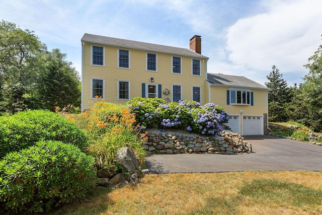 10 Briarfield Rd, South Dennis, MA 02660 - colonial home with a chimney, driveway, and a garage