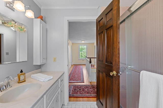 10 Briarfield Rd, South Dennis, MA 02660 - full bathroom featuring vanity, ornamental molding, baseboard heating, a shower with door, and wood finished floors