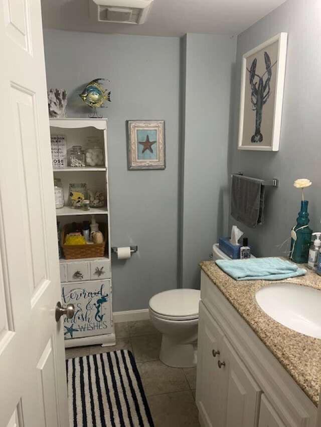 5 Greyhampton Rd, West Yarmouth, MA 02673 - half bathroom featuring vanity and tile patterned flooring