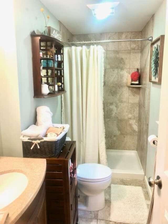 5 Greyhampton Rd, West Yarmouth, MA 02673 - bathroom featuring vanity, a stall shower, and tile patterned flooring