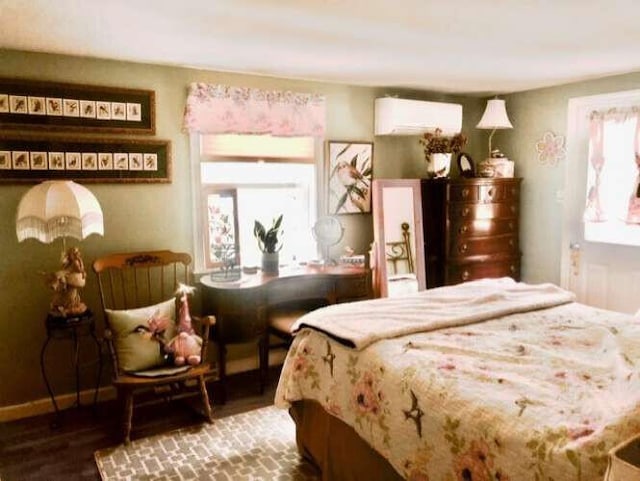 5 Greyhampton Rd, West Yarmouth, MA 02673 - bedroom with an AC wall unit and wood finished floors