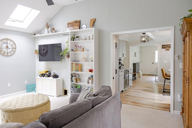 68 Harlow Rd, Sandwich, MA 02563 - living room featuring a skylight, lofted ceiling, and light carpet