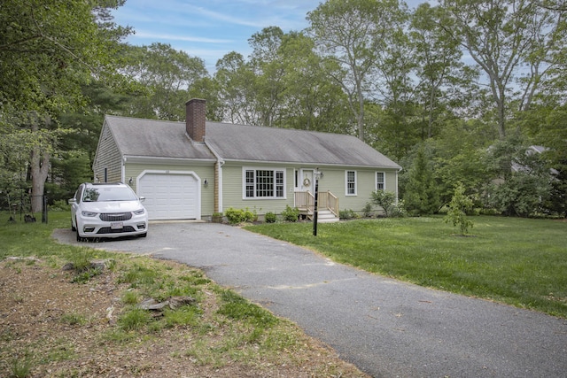 68 Harlow Rd, Sandwich, MA 02563 - view of front of house with a garage, a chimney, asphalt driveway, a front yard, and view of scattered trees