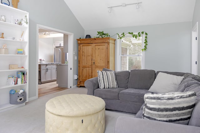 68 Harlow Rd, Sandwich, MA 02563 - living room with lofted ceiling, light carpet, and rail lighting
