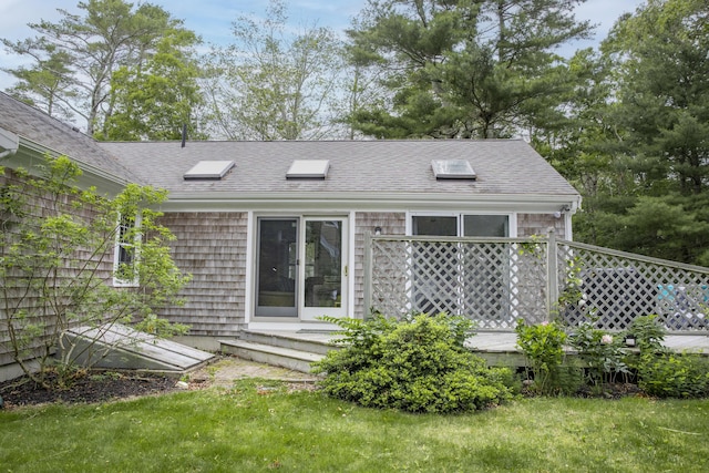 68 Harlow Rd, Sandwich, MA 02563 - rear view of property featuring roof with shingles and a yard