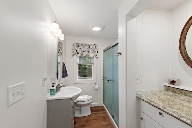 16 Town Neck Rd, Sandwich, MA 02563 - full bath featuring a shower stall, wood finished floors, vanity, baseboards, and toilet