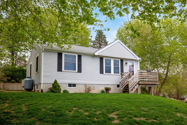 16 Town Neck Rd, Sandwich, MA 02563 - view of front of house with stairway, a front yard, and a deck