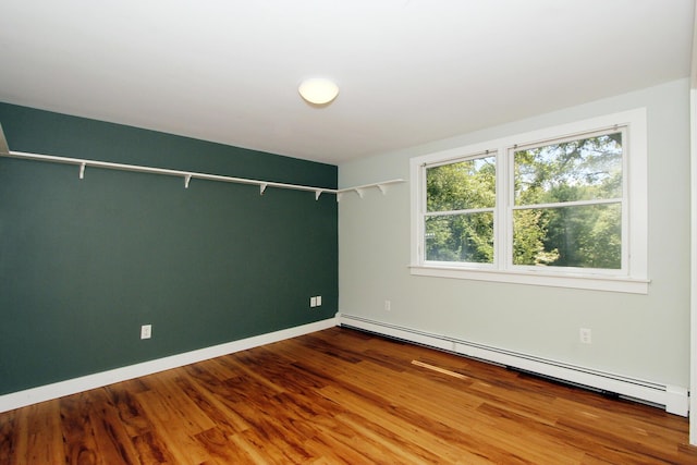 70 Deerfield Ln, Eastham, MA 02642 - empty room with baseboard heating, wood finished floors, and baseboards