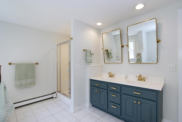 70 Deerfield Ln, Eastham, MA 02642 - full bathroom with a baseboard radiator, a shower stall, double vanity, tile patterned floors, and recessed lighting