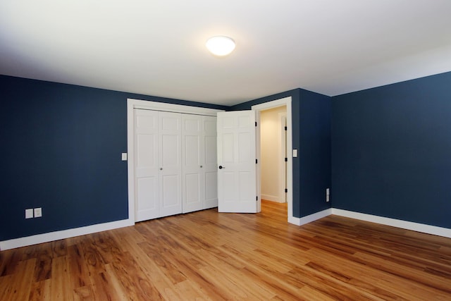 70 Deerfield Ln, Eastham, MA 02642 - unfurnished bedroom featuring baseboards, light wood-type flooring, and a closet