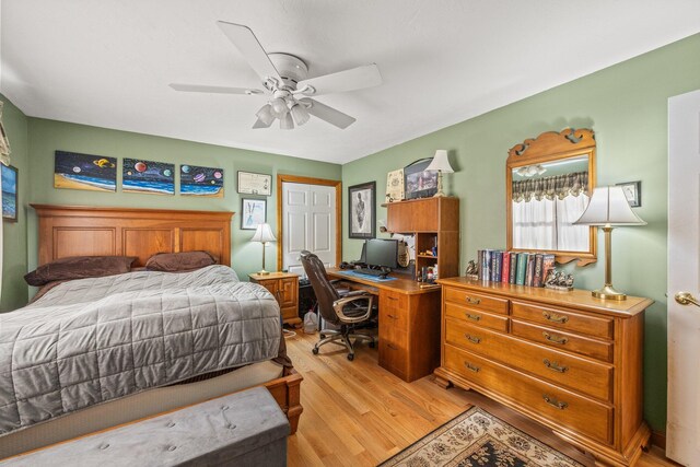 bedroom with light wood-style flooring and ceiling fan