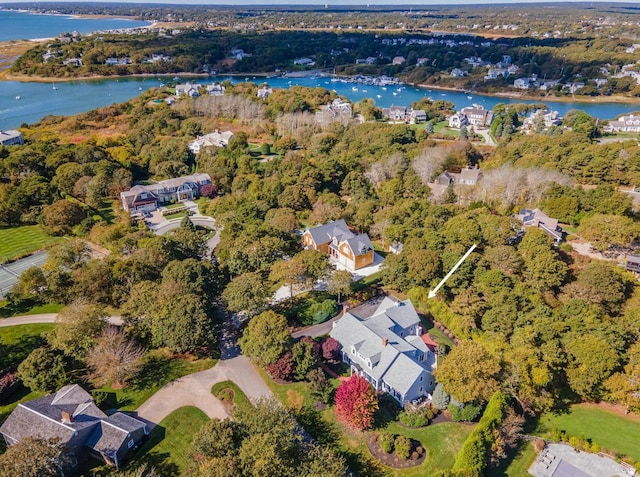 aerial view of property and surrounding area featuring a nearby body of water