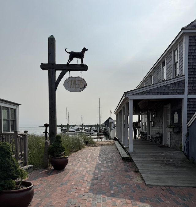 208 Irenes Way, Tisbury, MA 02568 - view of community with a water view and a patio