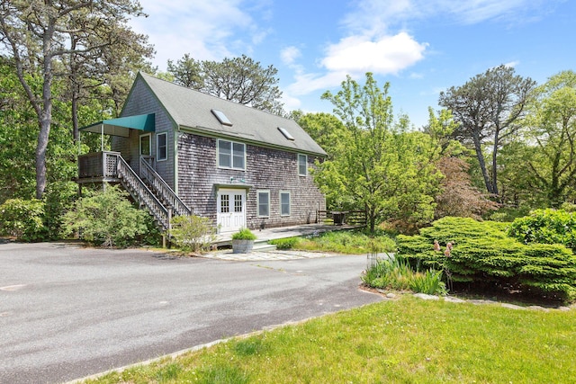 13 Try Works Rd, Truro, MA 02666 - view of front of house featuring roof with shingles, stairs, and a wooden deck