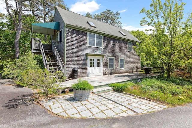 13 Try Works Rd, Truro, MA 02666 - rear view of property featuring a wooden deck, stairway, roof with shingles, and french doors