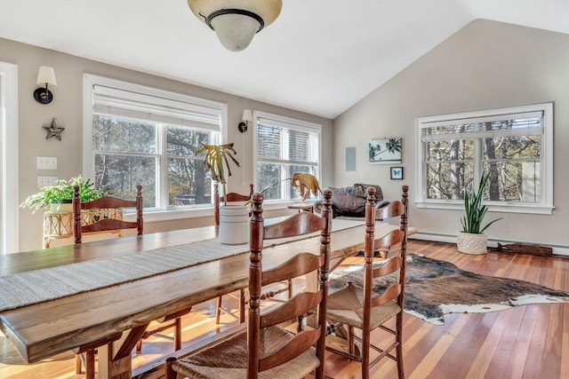 13 Try Works Rd, Truro, MA 02666 - dining area featuring vaulted ceiling and hardwood / wood-style flooring