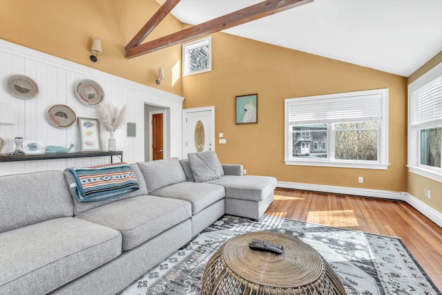 13 Try Works Rd, Truro, MA 02666 - living area with a baseboard heating unit, wood finished floors, high vaulted ceiling, and beamed ceiling