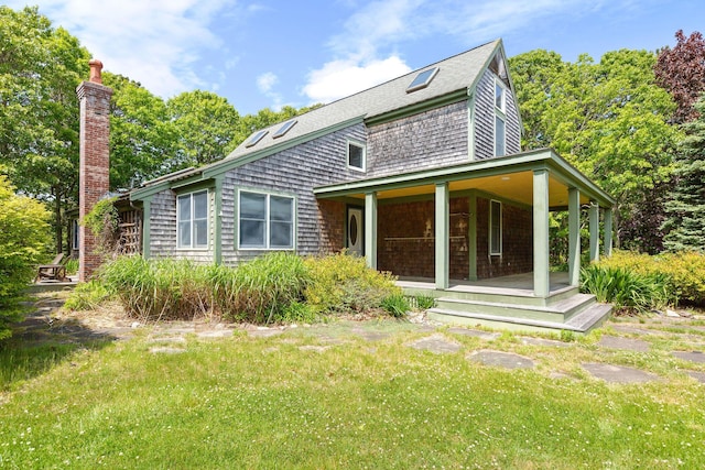 13 Try Works Rd, Truro, MA 02666 - rear view of property with covered porch, a chimney, a yard, and roof with shingles