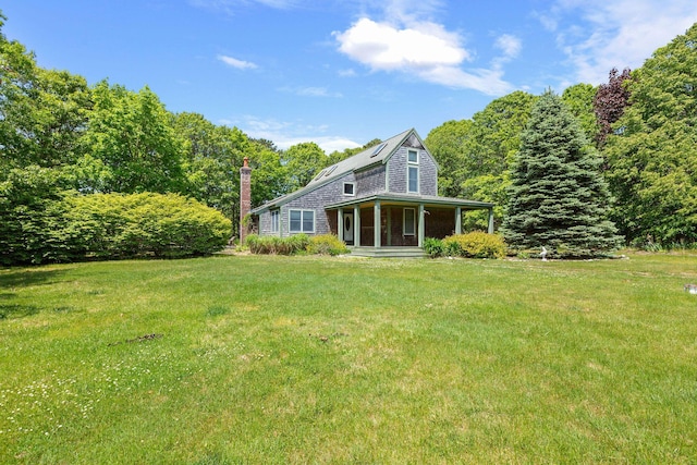 13 Try Works Rd, Truro, MA 02666 - rear view of house with a lawn, a porch, and a chimney
