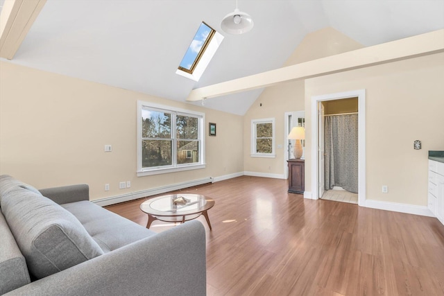 13 Try Works Rd, Truro, MA 02666 - living area with baseboard heating, wood finished floors, a skylight, and high vaulted ceiling