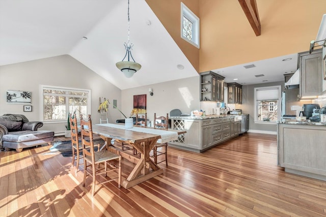 13 Try Works Rd, Truro, MA 02666 - dining room with wood-type flooring, healthy amount of natural light, and high vaulted ceiling
