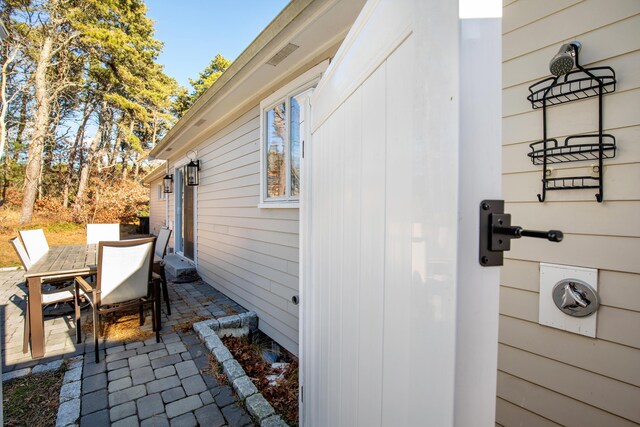 view of side of property featuring a patio area