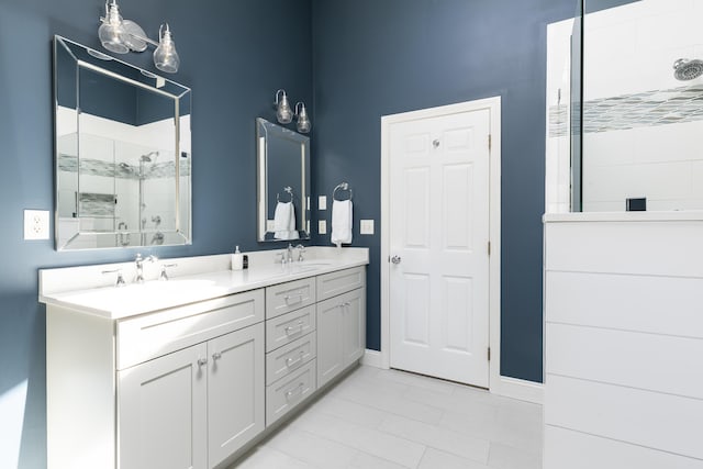 331 Riverview Dr, Chatham, MA 02633 - full bath featuring a stall shower, double vanity, baseboards, and tile patterned floors