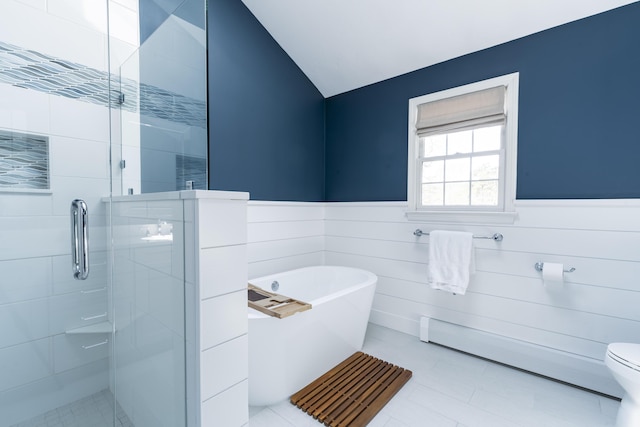 331 Riverview Dr, Chatham, MA 02633 - bathroom with a freestanding tub, a stall shower, wainscoting, lofted ceiling, and toilet