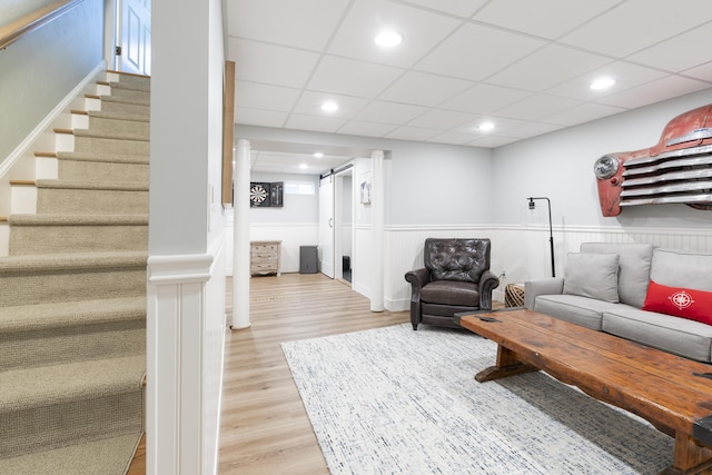 331 Riverview Dr, Chatham, MA 02633 - living area featuring light wood-type flooring, stairs, a wainscoted wall, recessed lighting, and a paneled ceiling