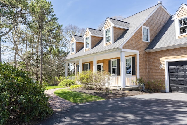 331 Riverview Dr, Chatham, MA 02633 - shingle-style home with a porch, roof with shingles, and driveway