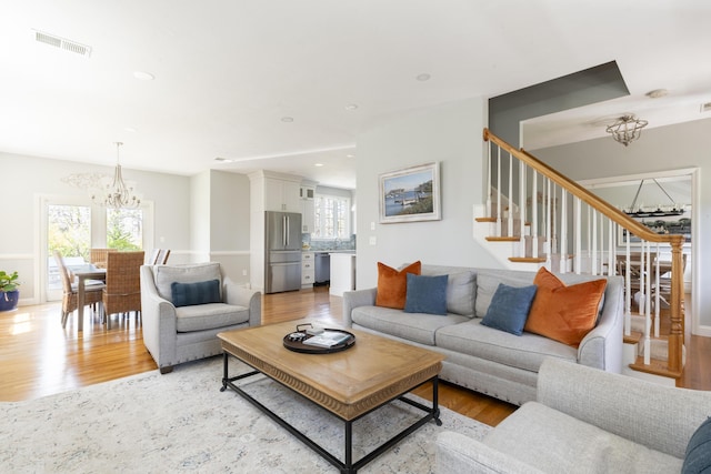 331 Riverview Dr, Chatham, MA 02633 - living room with a chandelier, light wood-style flooring, stairway, and recessed lighting