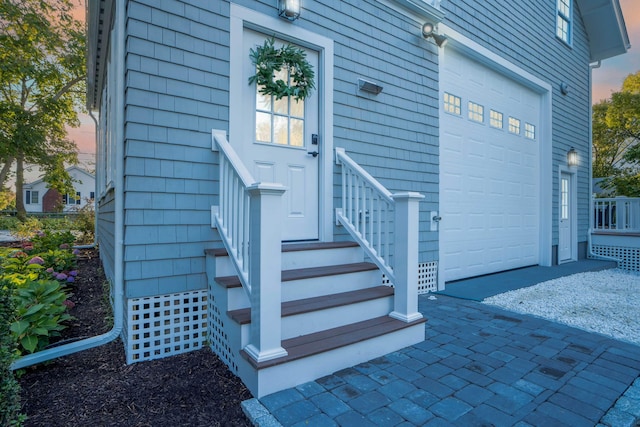 doorway to property featuring a garage