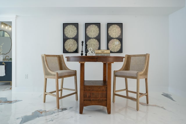 dining space with marble finish floor