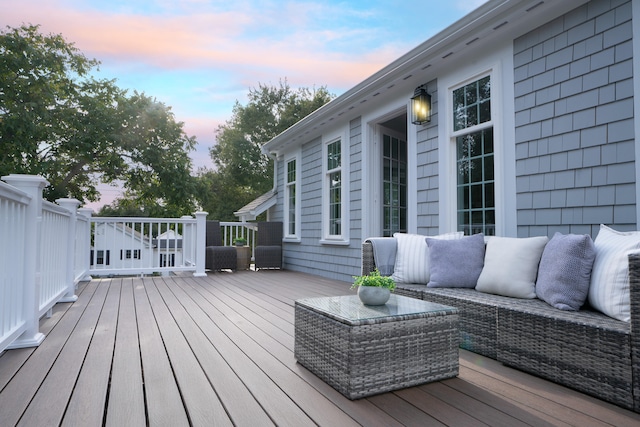 wooden terrace featuring outdoor lounge area